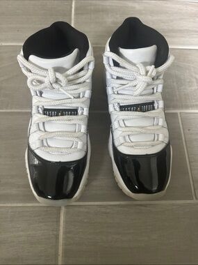 Jordan 11s patent leather black and white